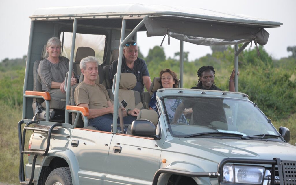 Guests travelling in a private safari vehicle